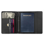 Black travel wallet with passport, money, and cards on a white background