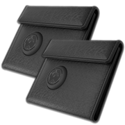 Two black textured leather passport wallets with a circular embossed logo, shown overlapping on a white background.