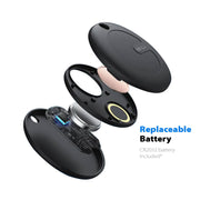 Black Travel Traka device with open lid showing replaceable battery compartment on a white background