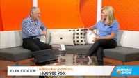 Two people sitting on a couch in a studio setting with an orange background, featuring 'The Morning Show' logo.